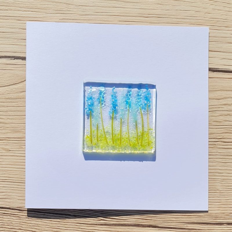 Keepsake fused glass floral blank cards featuring bright blue mixed lupins in a flower border.
