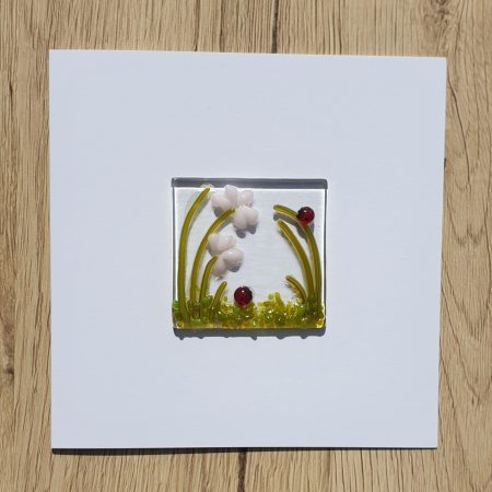 Keepsake fused glass blank card featuring a pair of ladybirds and pink flowers