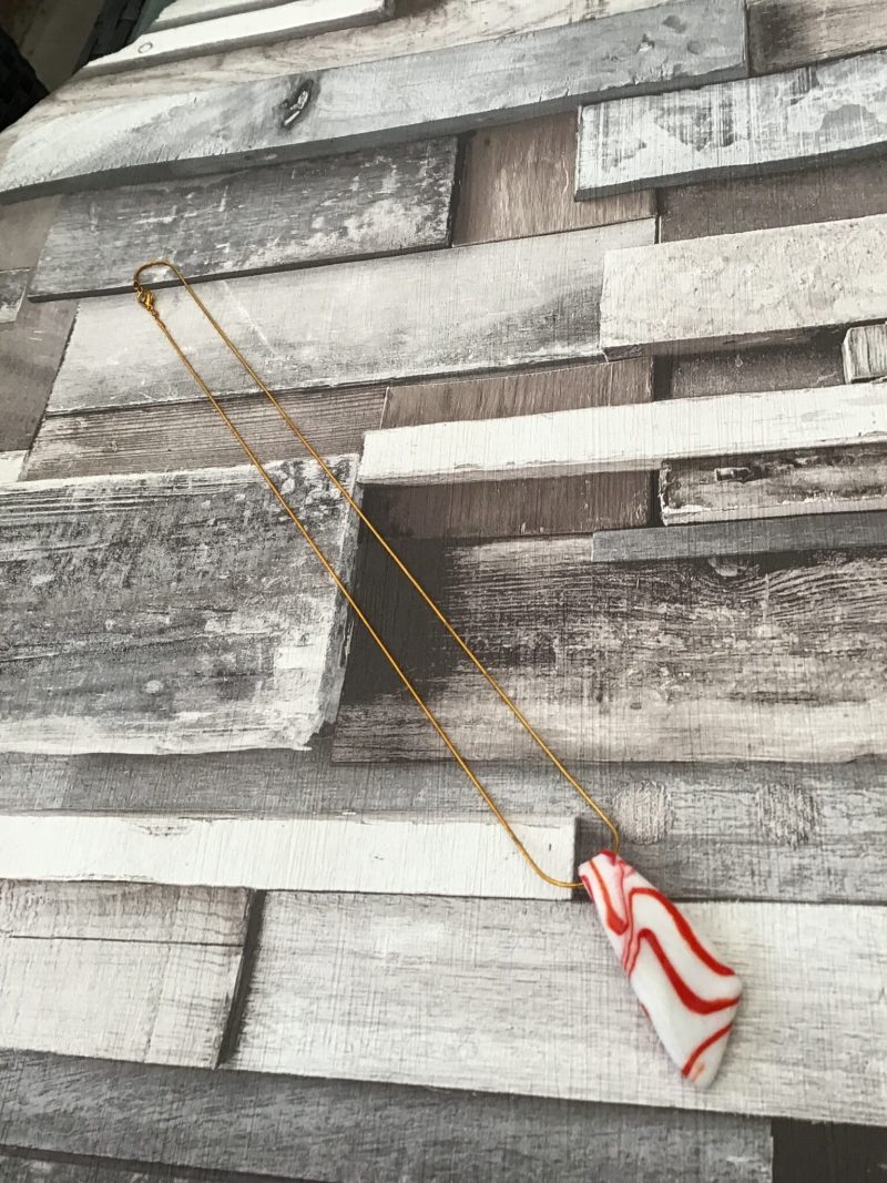 Glass pendant and gold plated snake chain