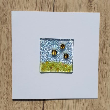 Keepsake fused glass blank card featuring a trio of bees in a meadow of yellow and coral flowers