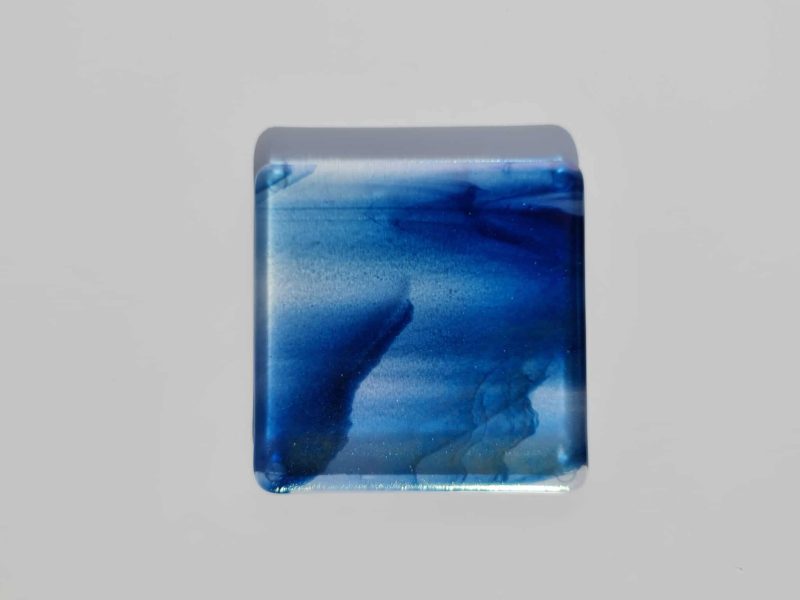 Fused glass streaky blue colour coaster with iridised rainbow finish