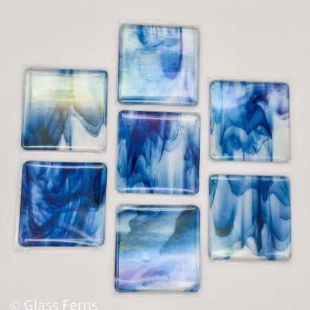 Fused glass streaky blue colour coaster with iridised rainbow finish