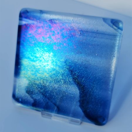Fused glass streaky blue colour coaster with iridised rainbow finish