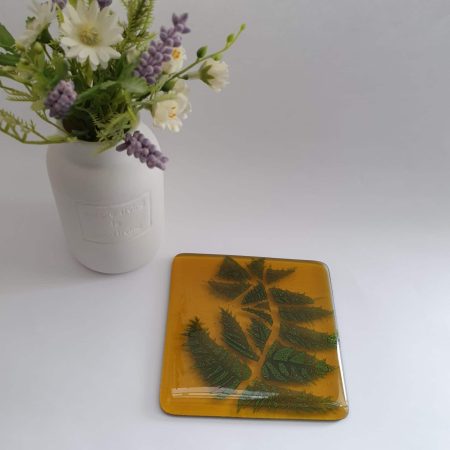 Fused glass golden amber coaster with sparkly fern design