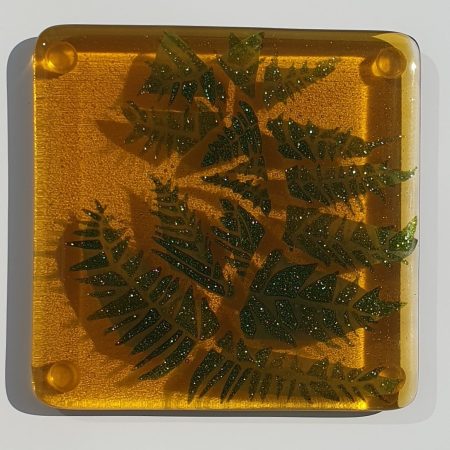 Fused glass golden amber coaster with sparkly fern design