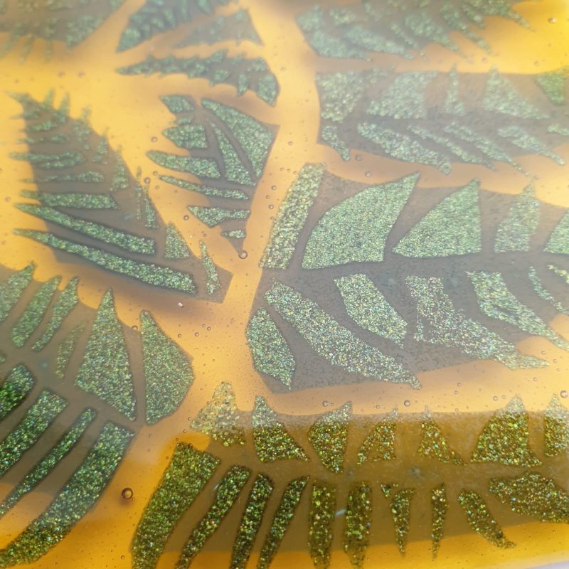 Fused glass golden amber coaster with sparkly fern design