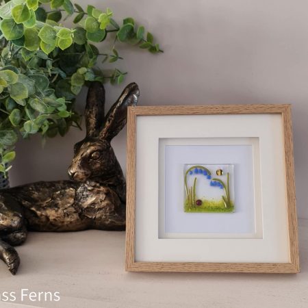 Keepsake fused glass blank card featuring a little bee buzzing in amongst pale lilac pom-pom flowers