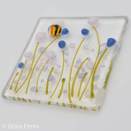 Keepsake fused glass blank card featuring a joyful buzzing bee in delicate pastel flowers