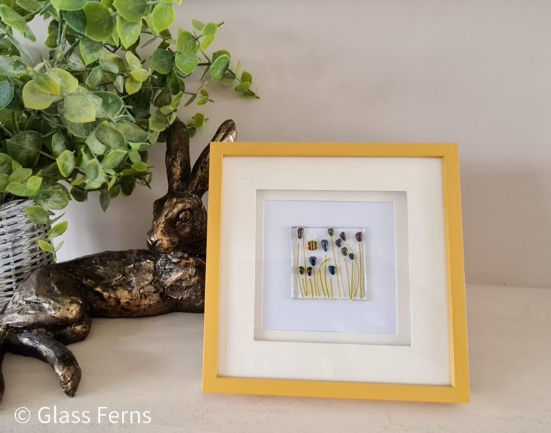 Keepsake fused glass blank card featuring a little bee buzzing in amongst blue pom-pom flowers
