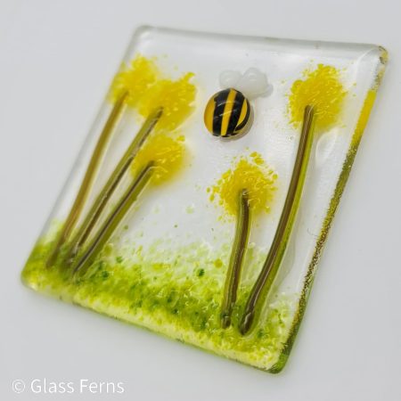 Keepsake fused glass blank card featuring a little bee buzzing in amongst the yellow pom-pom flowers