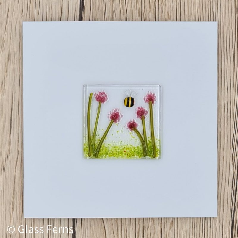 Keepsake fused glass blank card featuring a little bee buzzing in amongst pink pom-pom flowers