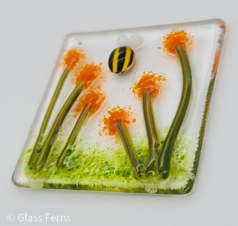 Keepsake fused glass blank card featuring a little bee buzzing in amongst orange pom-pom flowers