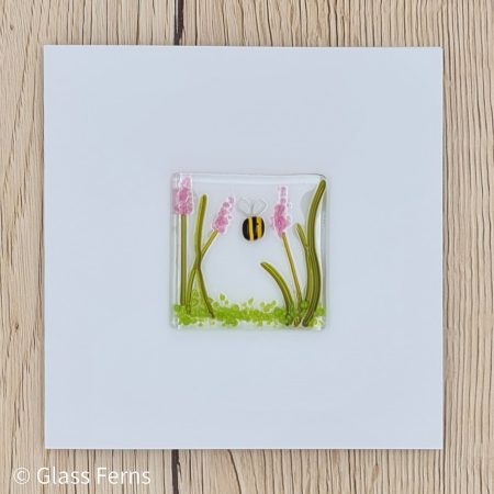 Keepsake fused glass blank card featuring a little bee buzzing in amongst pink flower spikes
