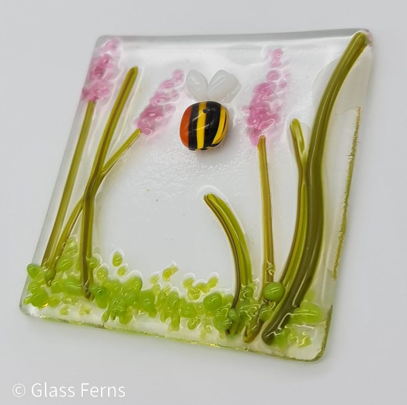 Keepsake fused glass blank card featuring a little bee buzzing in amongst pink flower spikes