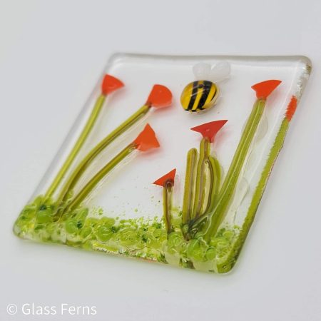 Keepsake fused glass blank card featuring a little bee buzzing in amongst bright orange Poppies