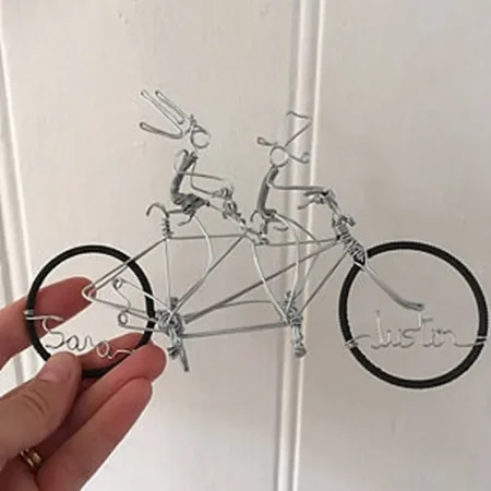 Tandem bicycle wedding cake topper.