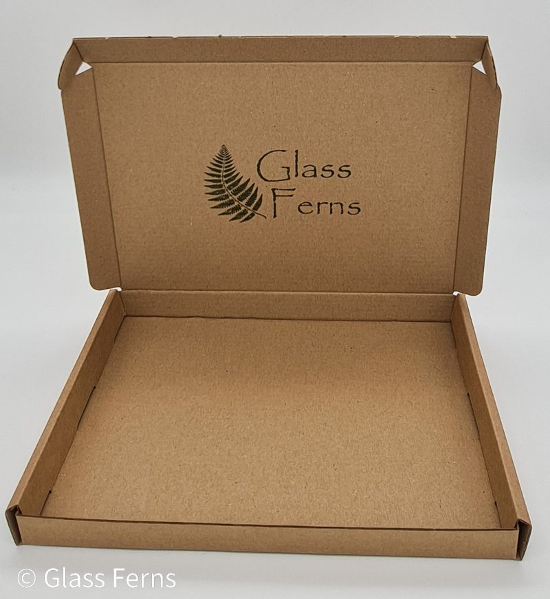 Fused glass coaster rainbow iridised on black