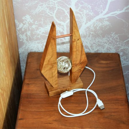 Contemporary oak bedside or table lamp.