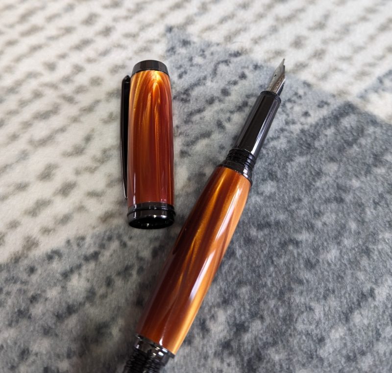 Acrylic Jr Gentleman-style fountain pen made from graduated golden brown acrylic