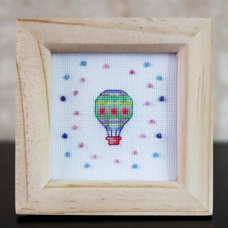 A wooden framed cross stitch a lovely little gift for yourself or a loved one.