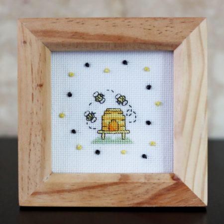 A wooden framed cross stitch a lovely little gift for yourself or a loved one.