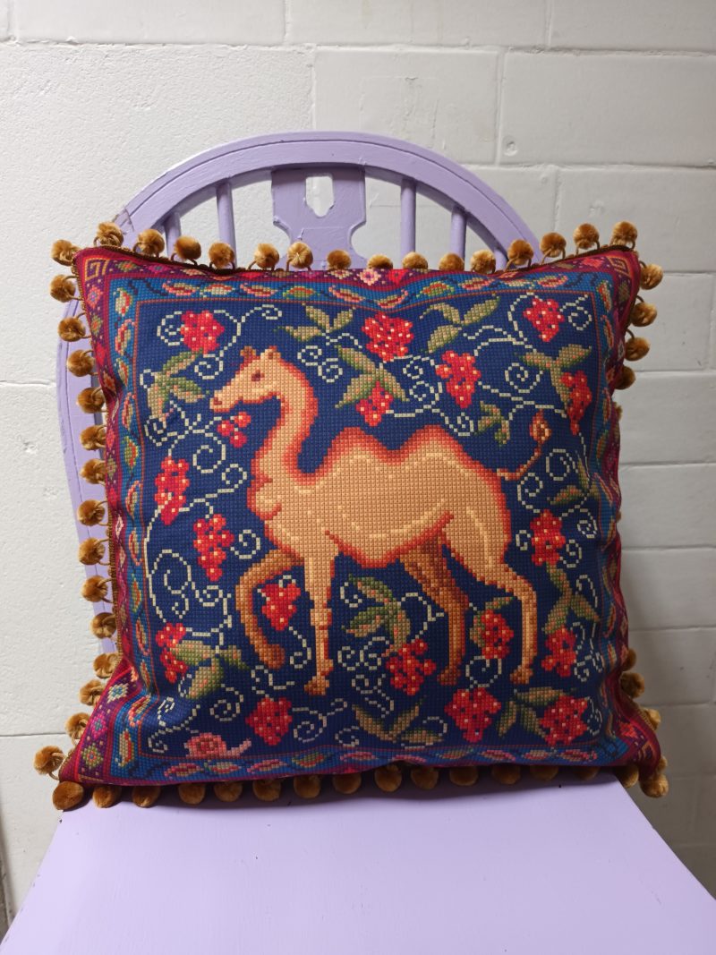 The Camel Velvet Cushion, Tapestry Style Print with Pom-pom Trim.