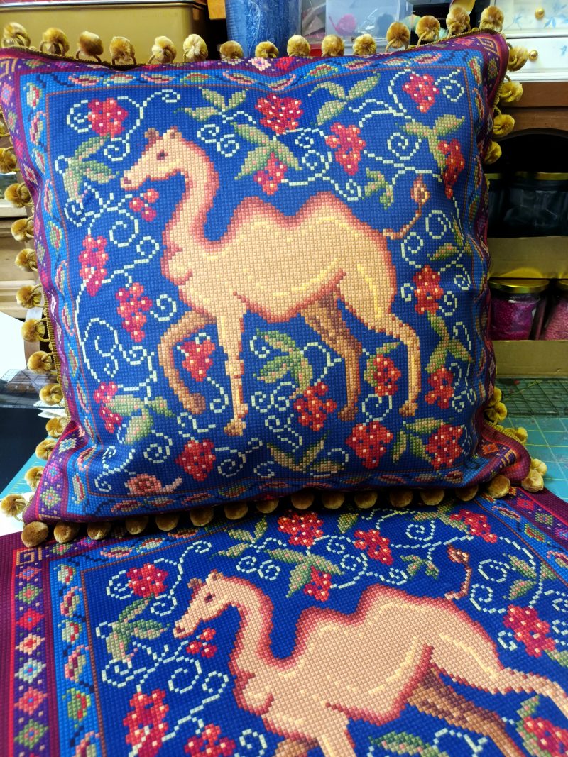 The Camel Velvet Cushion, Tapestry Style Print with Pom-pom Trim.