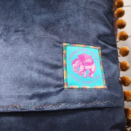 The Camel Velvet Cushion, Tapestry Style Print with Pom-pom Trim.