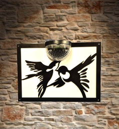 Birds solar light wall plaque.