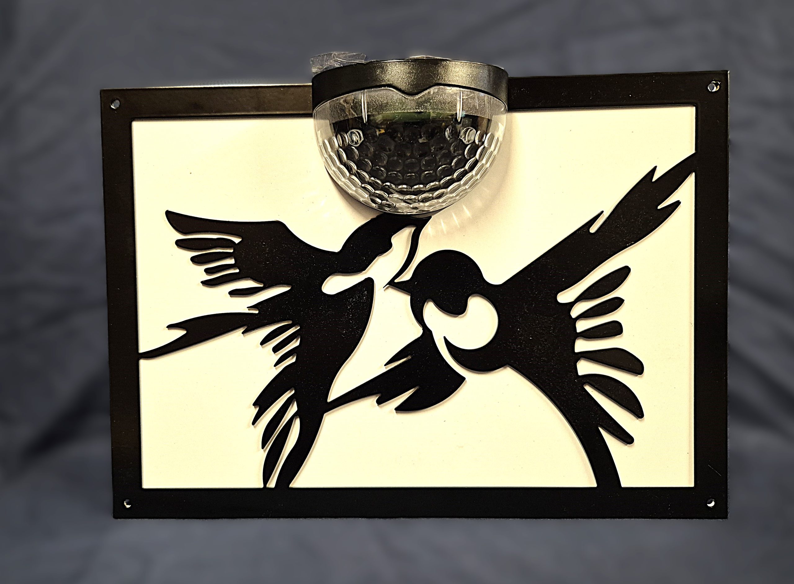 Birds solar light wall plaque.