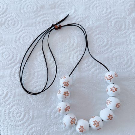 White Wood Beads with Chocolate Maple Leaf Pattern on a Slide Adjustable Black Nylon Satin Cord Necklace