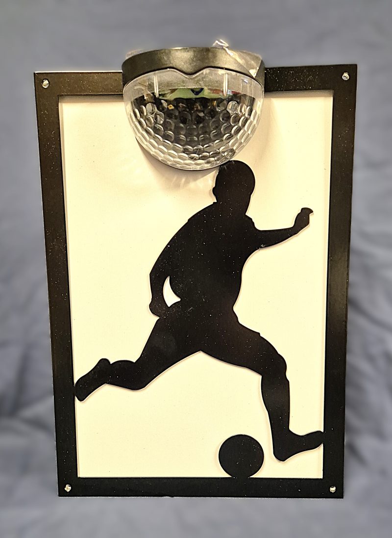 Footballer solar light wall plaque.