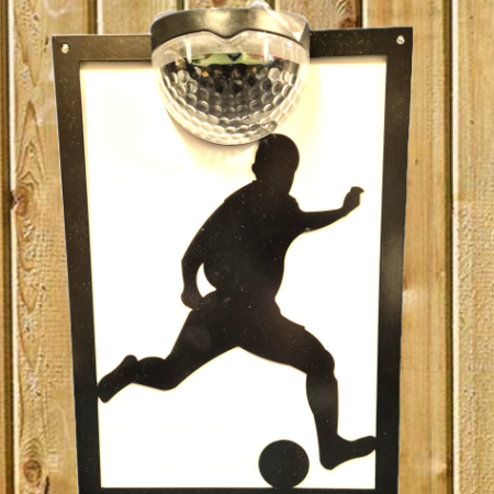 Footballer solar light wall plaque.