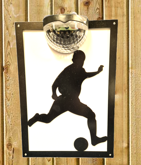 Footballer solar light wall plaque.