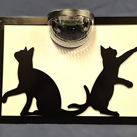 Playful cats solar light wall plaque.
