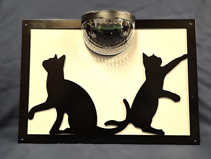 Playful cats solar light wall plaque.