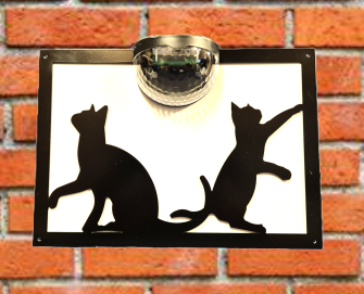 Playful cats solar light wall plaque.