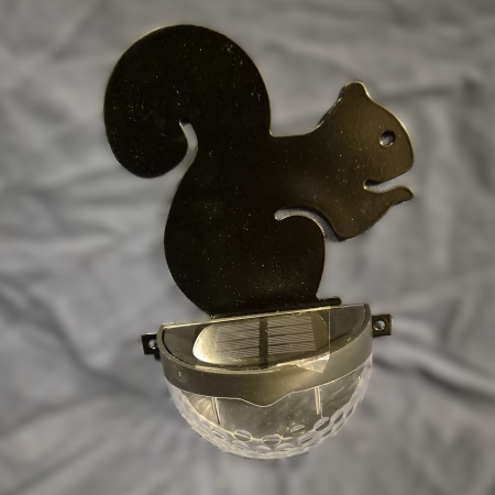 Squirrel fence post solar light.