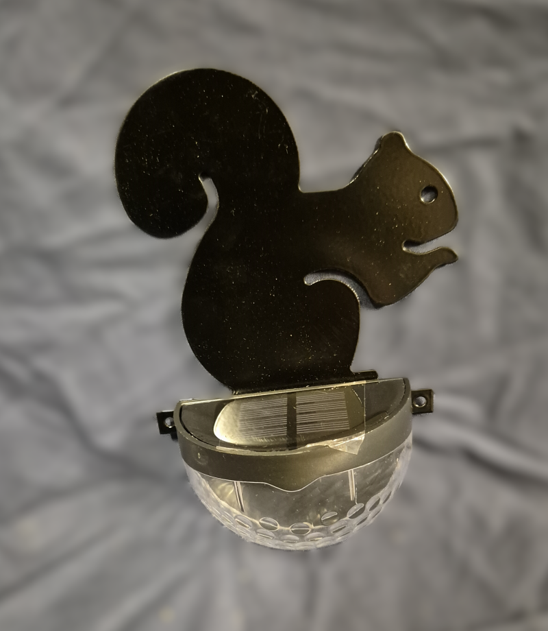 Squirrel fence post solar light.