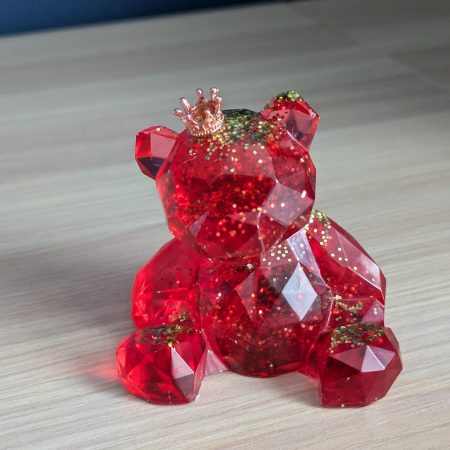 Resin bears come in various colours with various accessories