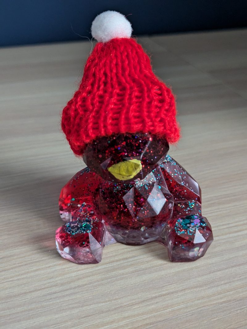 Resin bears come in various colours with various accessories