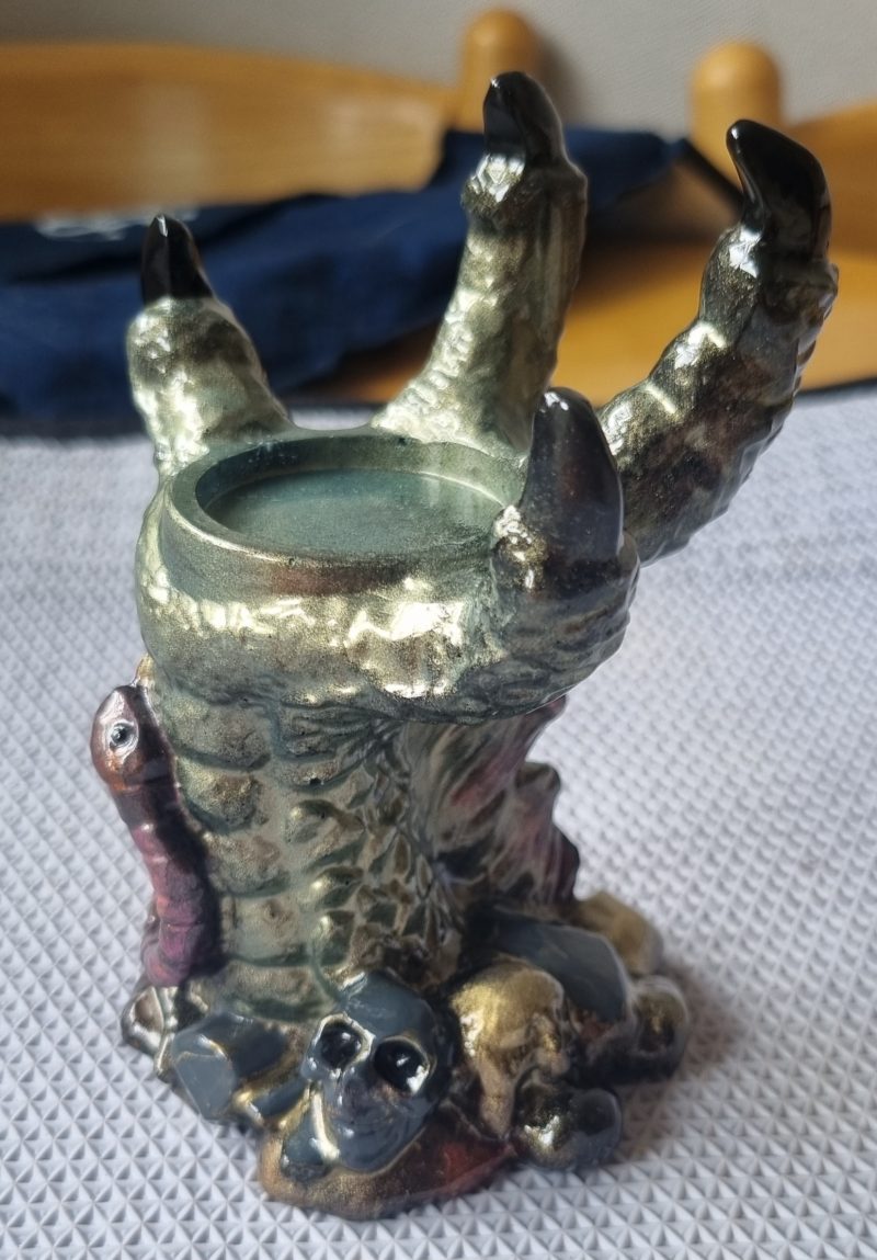 medieval looking resin dragon claw candle holder and ornament
