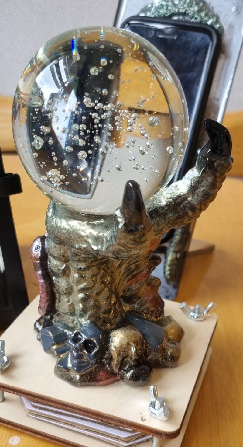 medieval looking resin dragon claw candle holder and ornament
