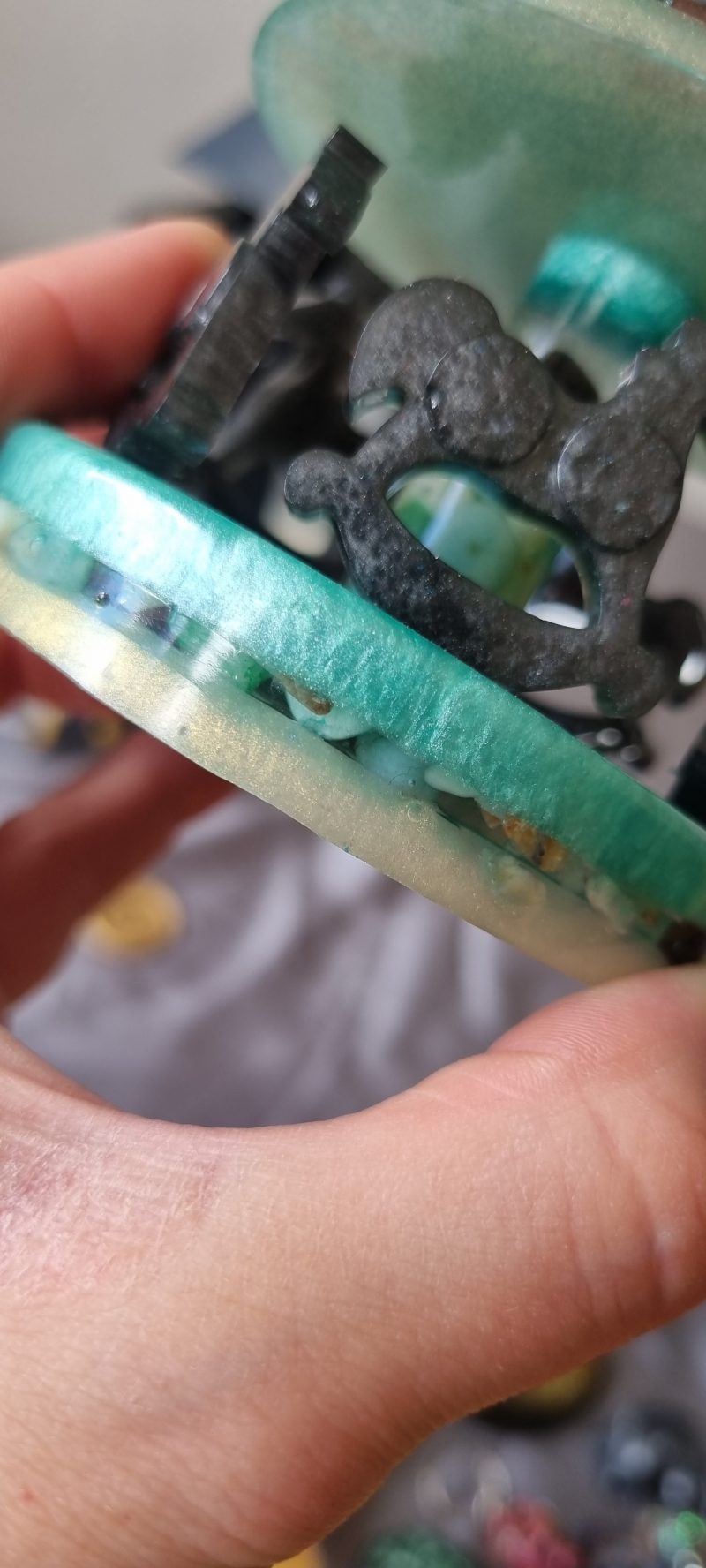 Resin merry-go-round ornament in various colours and textures