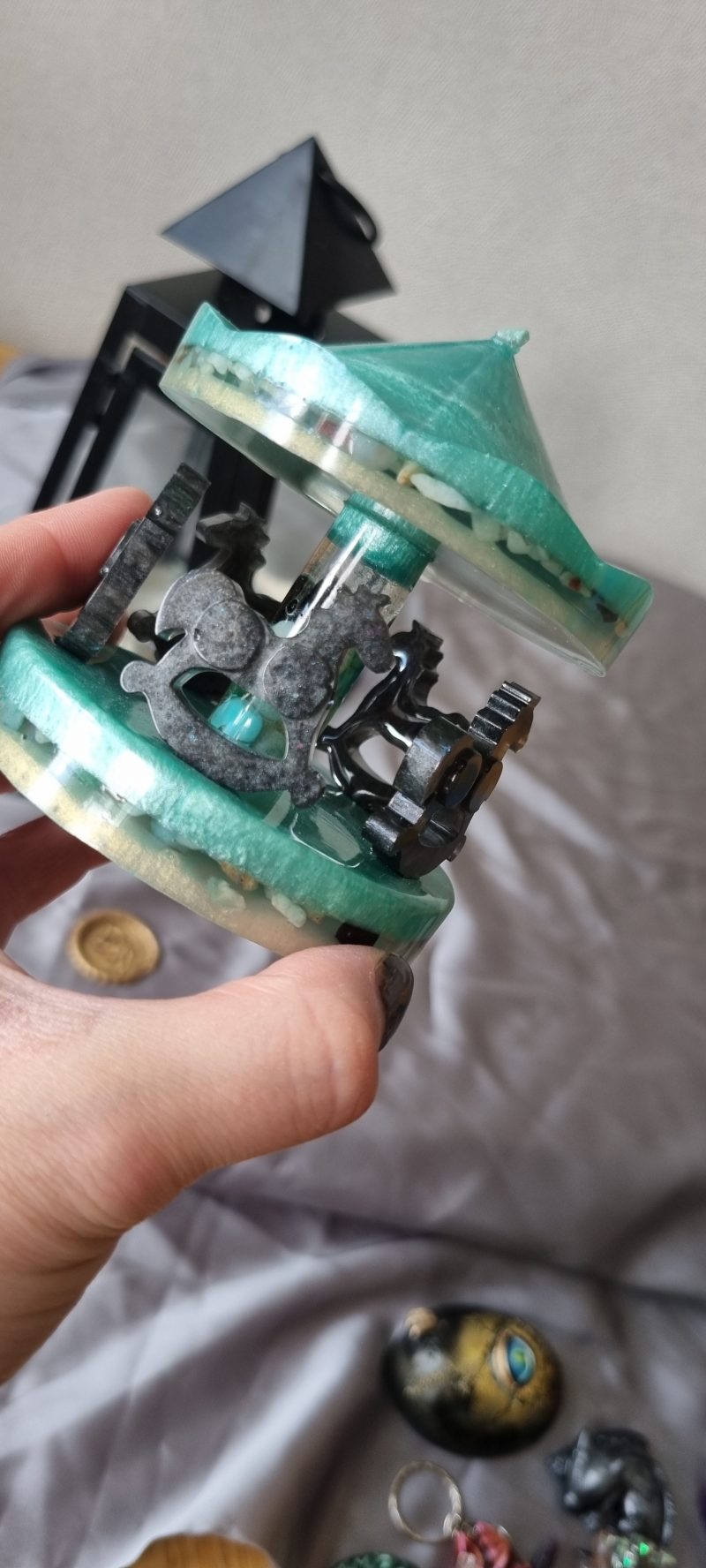 Resin merry-go-round ornament in various colours and textures