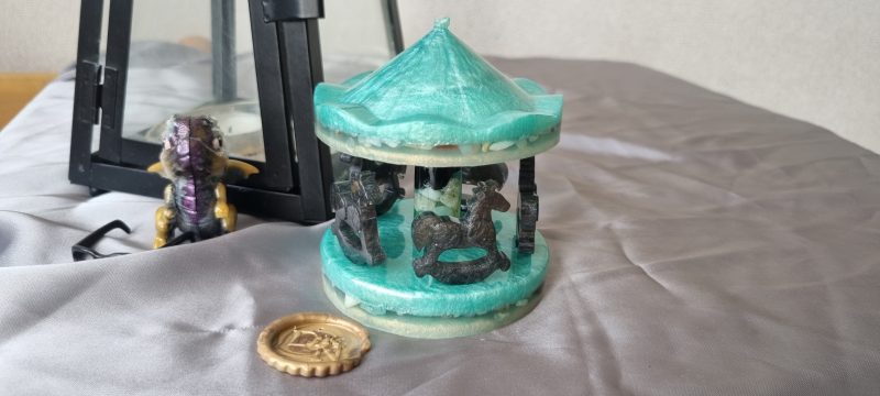 Resin merry-go-round ornament in various colours and textures