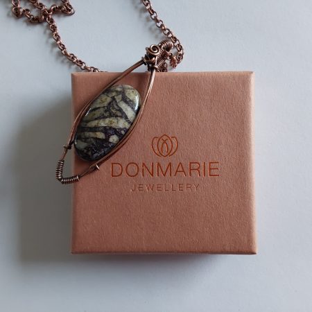 Wire wrapped Flourite in Feldspar cabochon pendant.