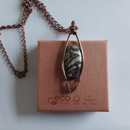 Wire wrapped Flourite in Feldspar cabochon pendant.