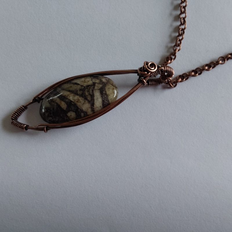 Wire wrapped Flourite in Feldspar cabochon pendant.