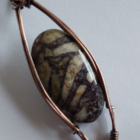 Wire wrapped Flourite in Feldspar cabochon pendant.